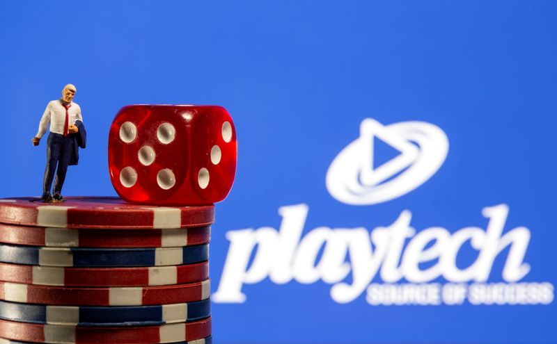 &copy; Reuters. FILE PHOTO: Businessman toy figure is placed on gambling chips in front of displayed Playtech logo in this illustration taken, November 8, 2021. REUTERS/Dado Ruvic/Illustration