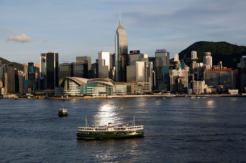 &copy; Reuters. FILE PHOTO: A Star Ferry boat crosses Victoria Harbour in front of a skyline of buildings in Hong Kong, China June 29, 2020. REUTERS/Tyrone Siu/File Photo
