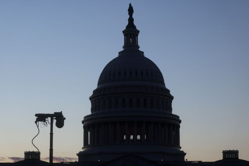 &copy; Reuters. A security camera can be seen near the U.S. Capitol building as the sun sets in Washington, U.S., November 29, 2021. REUTERS/Leah Millis