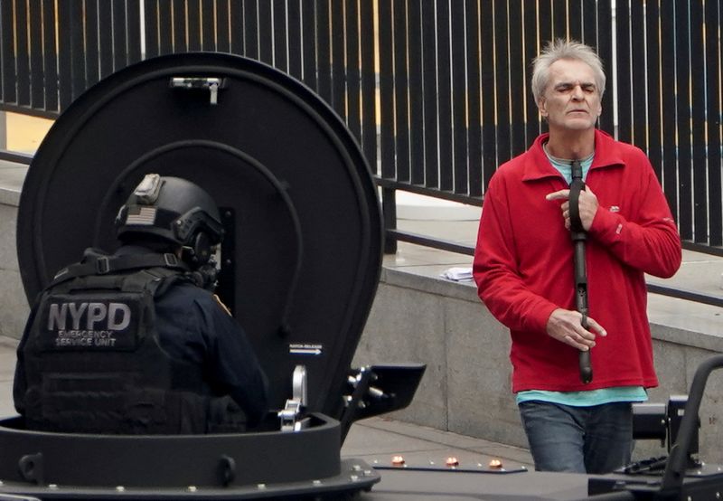 Man with gun outside U.N. in New York surrenders to police