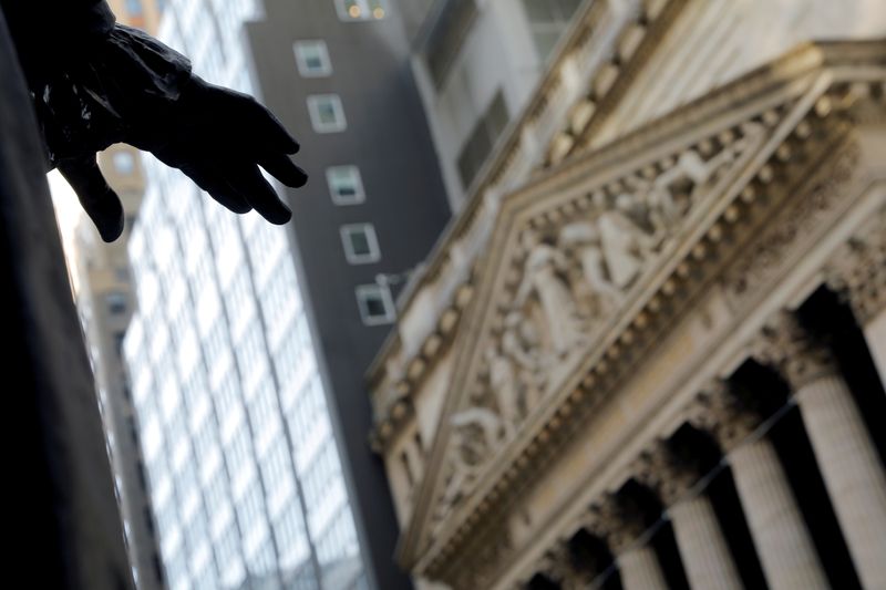 &copy; Reuters. FILE PHOTO: The hand of a sculpture of former U.S. President George Washington is pictured with the facade of the New York Stock Exchange (NYSE) in Manhattan in New York City, New York, U.S., January 28, 2021. REUTERS/Mike Segar