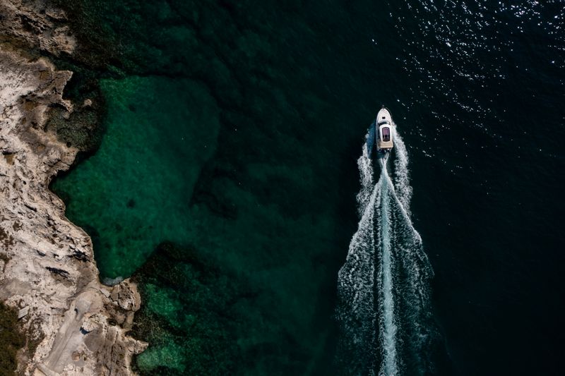 &copy; Reuters. FILE PHOTO: Boat passes in the Adriatic sea off Porec coast, Croatia, April 20, 2021. REUTERS/Antonio Bronic/File Photo