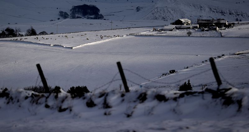 &copy; Reuters. FILE PHOTO: A farm house is seen in the snow after Storm Arwen in Buxton, Derbyshire, Britain, November 29, 2021. REUTERS/Carl Recine