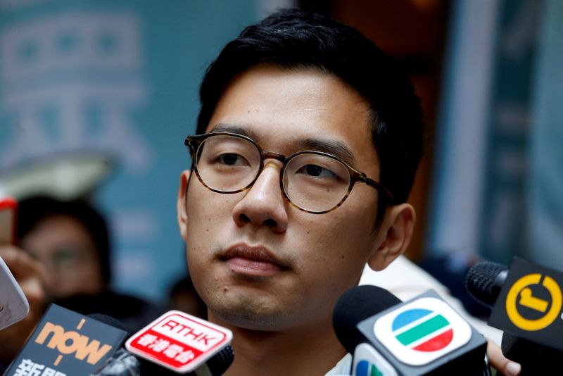&copy; Reuters. FILE PHOTO: Pro-democracy activist Nathan Law is interviewed by journalists outside the Final Court of Appeal after being granted bail in Hong Kong, China October 24, 2017.   REUTERS/Bobby Yip/File Photo