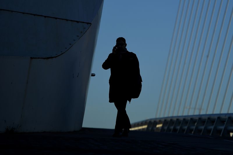 &copy; Reuters. FILE PHOTO: A commuter makes their way into work in the morning in the financial district of Dublin, Ireland October 18, 2018. REUTERS/Clodagh Kilcoyne