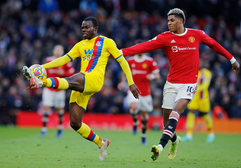 &copy; Reuters. Soccer Football - Premier League - Manchester United v Crystal Palace - Old Trafford, Manchester, Britain - December 5, 2021 Crystal Palace's Tyrick Mitchell in action with Manchester United's Marcus Rashford REUTERS/Phil Noble 