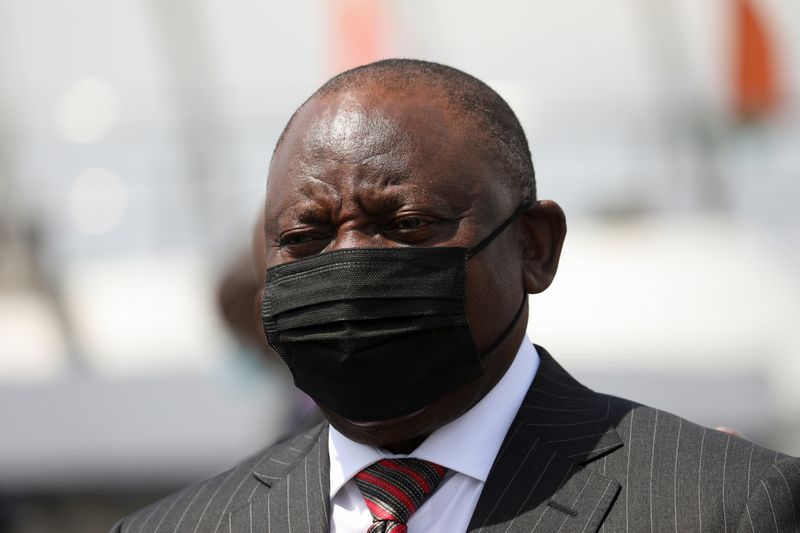 &copy; Reuters. FILE PHOTO: South African President Cyril Ramaphosa wears a face mask as he looks on during a visit with Ivory Coast's Prime Minister Patrick Achi at the port in Abidjan, Ivory Coast December 3, 2021. REUTERS/Luc Gnago