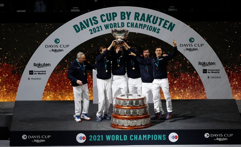 &copy; Reuters. Tennis - Davis Cup Finals - Madrid Arena, Madrid, Spain - December 5, 2021 Russian Tennis Federation team celebrates with trophy on the podium after winning the Davis Cup REUTERS/Susana Vera