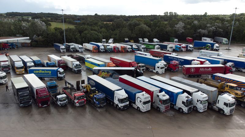 &copy; Reuters. FILE PHOTO: Lorries are seen at Lymm Services, Lymm, Britain, September 29, 2021. Picture taken with a drone. REUTERS/Jason Cairnduff