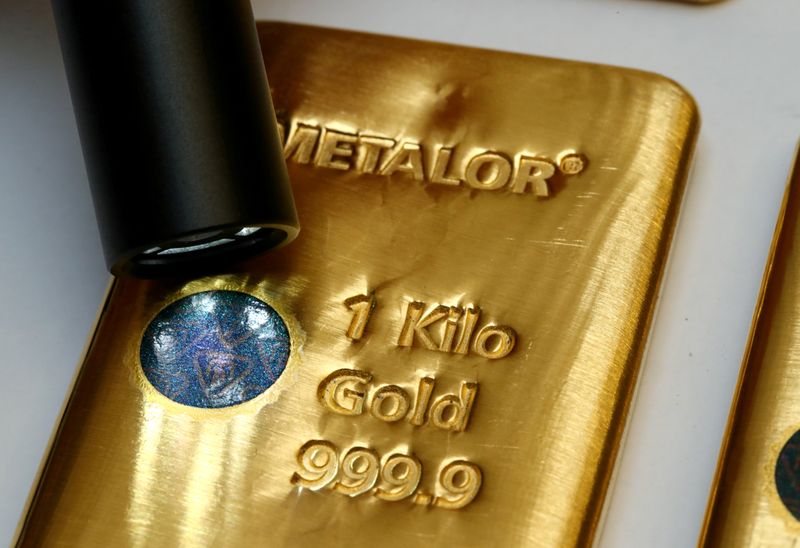 &copy; Reuters. FILE PHOTO: The Sicpa Oasis validator system (bullion protect) is pictured on one kilogram bar of gold at Swiss refiner Metalor in Marin near Neuchatel, Switzerland July 5, 2019. REUTERS/Denis Balibouse/File Photo/File Photo