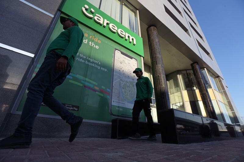 &copy; Reuters. FILE PHOTO: Careem employees walk past the company headquarters in Dubai, UAE December 13, 2018.  REUTERS/Satish Kumar