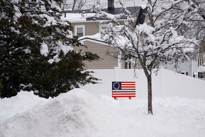 &copy; Reuters. FILE PHOTO: A Betsy Ross American flag is seen after Winter Storm Orlena brought about 18" of snow in Wilmington, Massachusetts, U.S., February 3, 2021.  REUTERS/Allison Dinner