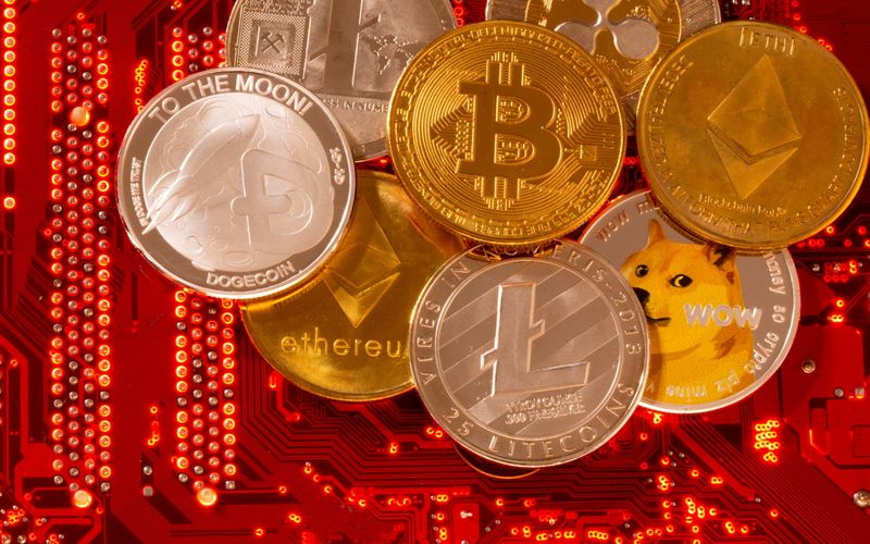 &copy; Reuters.  Representations of cryptocurrencies Bitcoin, Ethereum, DogeCoin, Ripple, Litecoin are placed on PC motherboard in this illustration taken, June 29, 2021. REUTERS/Dado Ruvic/File Photo