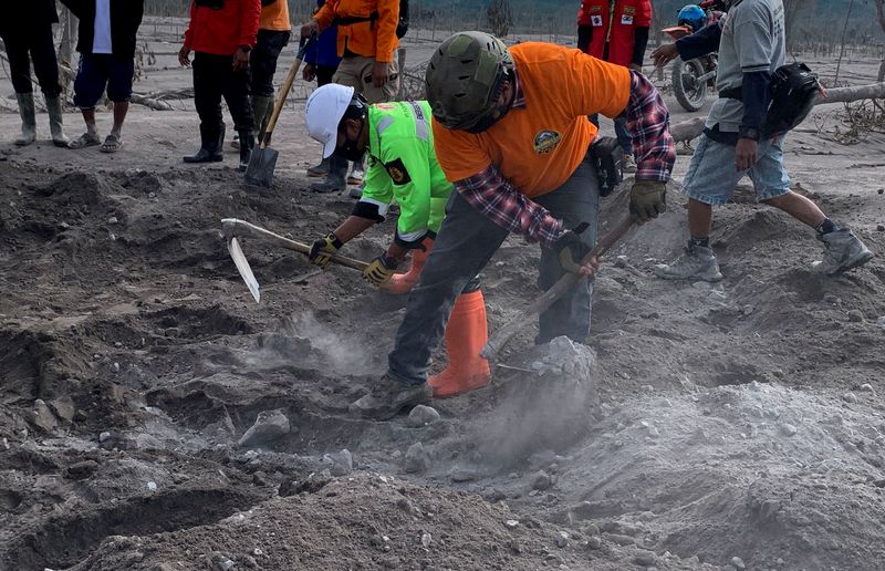 Hope, sadness as volunteers search for victims of Indonesian volcano