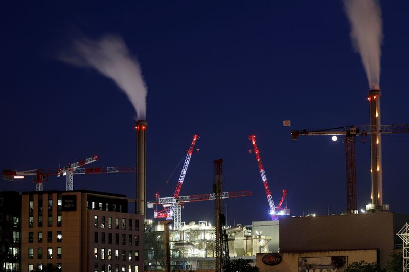&copy; Reuters. FILE PHOTO: Cranes are seen at a closed construction site of extension buildings on the banks of the Seine River in Paris, during a lockdown imposed to slow the spread of the coronavirus disease (COVID-19) in Paris, France April 8, 2020.  REUTERS/Charles 