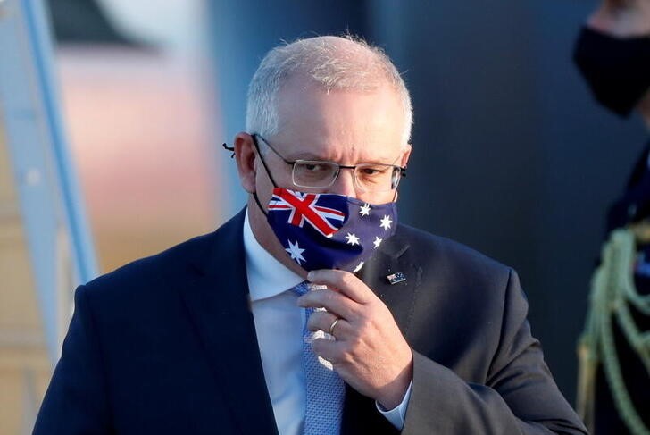 &copy; Reuters. １２月８日、オーストラリアのモリソン首相は、来年の北京冬季五輪に豪政府高官を派遣しないと述べた。写真は昨年１１月、羽田空港で撮影（２０２１年　ロイター／Issei Kato）