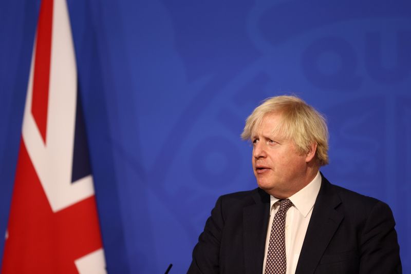 Under fire, UK PM apologises for staff joking about Christmas lockdown party