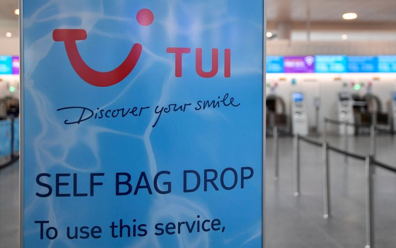 © Reuters. FILE PHOTO: TUI sign is seen at the check-in area at Gatwick Airport, as travel restrictions are eased following the coronavirus disease (COVID-19) outbreak, in Gatwick, Britain July 10, 2020. REUTERS/Toby Melville