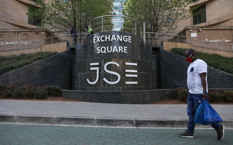 &copy; Reuters. A man walks past the Johannesburg Stock Exchange (JSE), as the coronavirus disease (COVID-19) lockdown regulations are eased in Sandton, South Africa, September 10, 2020. REUTERS/Siphiwe Sibeko