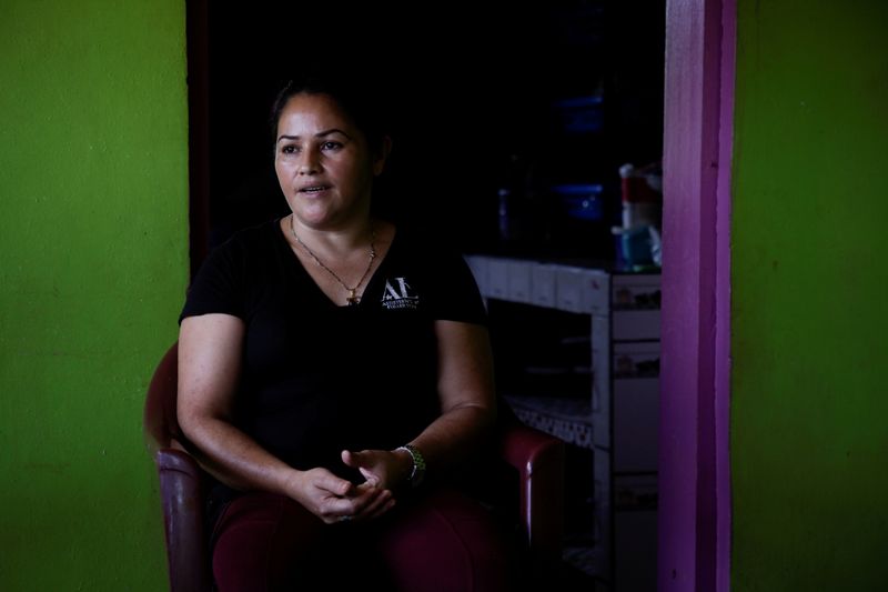&copy; Reuters. Coffee producer Maria Bonilla, whose 4 sons embarked on the treacherous journey to the U.S., speaks during an interview with Reuters in her house, at a coffee farm in El Laurel, in the state of Olancho, Honduras September 22, 2021. REUTERS/Fredy Rodriguez