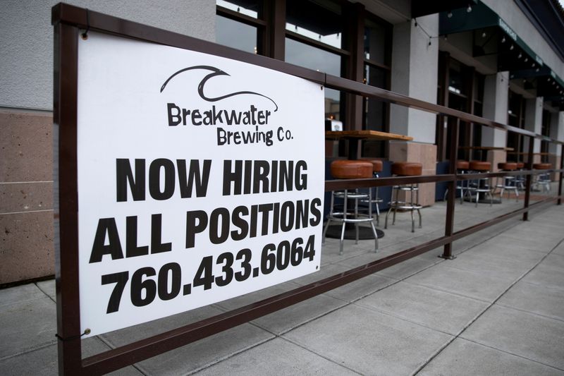 &copy; Reuters. FILE PHOTO: A restaurant advertising jobs looks to attract workers in Oceanside, California, U.S., May 10, 2021. REUTERS/Mike Blake/File Photo