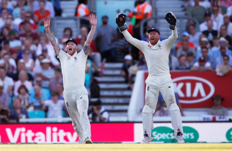 &copy; Reuters. FILE PHOTO: Cricket - Ashes 2019 - Fifth Test - England v Australia - Kia Oval, London, Britain - September 15, 2019  England's Jonny Bairstow celebrates alongside teammate Ben Stokes after taking a catch to dismiss Australia's Pat Cummins   Action Images