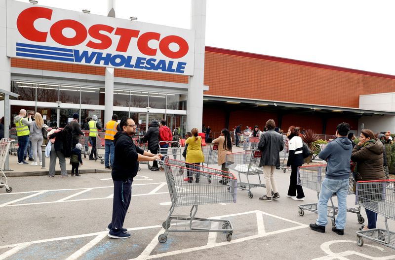 &copy; Reuters. FILE PHOTO: FILE PHOTO: Customers queue to enter a Costco Wholesale store in Chingford, Britain March 15, 2020. REUTERS/John Sibley/File Photo  GLOBAL BUSINESS WEEK AHEAD/File Photo