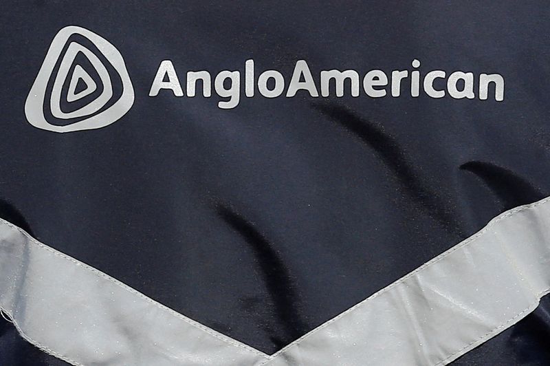 &copy; Reuters. FILE PHOTO: The logo of Anglo American is seen on a jacket of an employee at the Los Bronces copper mine, on the outskirts of Santiago, Chile March 14, 2019.  REUTERS/Rodrigo Garrido/File Photo  GLOBAL BUSINESS WEEK AHEAD