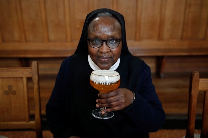 &copy; Reuters. Benedictine Sister Gertrude drinks a "Maredret" beer during an interview with Reuters at the Maredret Abbey, which signed a partnership with the Anthony Martin brewing group to produce two beers labeled "Maredret", with ingredients inspired by the monaste