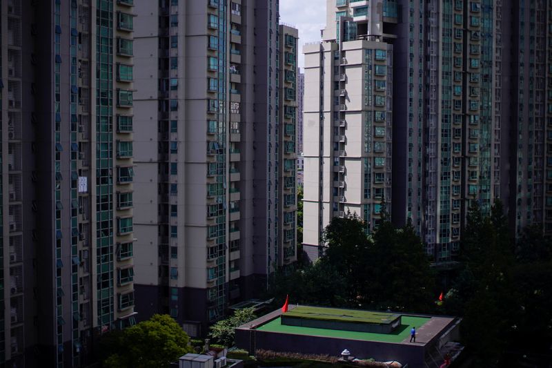 &copy; Reuters. FILE PHOTO: Buildings of residential compounds are seen in Shanghai, following the coronavirus disease (COVID-19) outbreak, China October 9, 2020. REUTERS/Aly Song