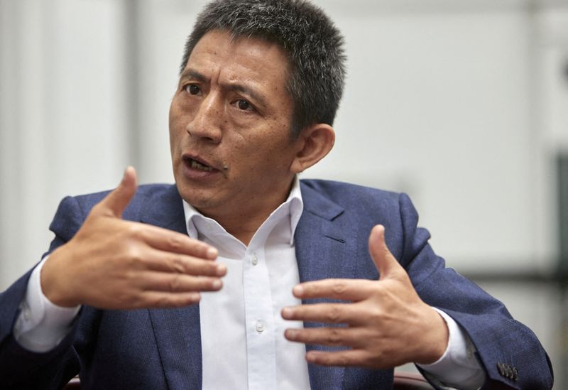 &copy; Reuters. FILE PHOTO: Li Chenggang, China's Ambassador to the World Trade Organisation (WTO), gestures during an interview with Reuters on the sidelines of a ministerial meeting on the fisheries industry in Geneva, Switzerland, July 15, 2021. REUTERS/Denis Balibous