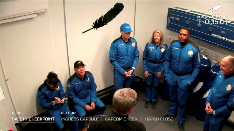 &copy; Reuters. Billionaire Jeff Bezos, founder of ecommerce company Amazon.com Inc, sits with the crew of a scheduled flight before they board Blue Origin's New Shepard rocket near Van Horn, Texas, U.S. December 11, 2021.        Blue Origin/Handout via REUTERS.  