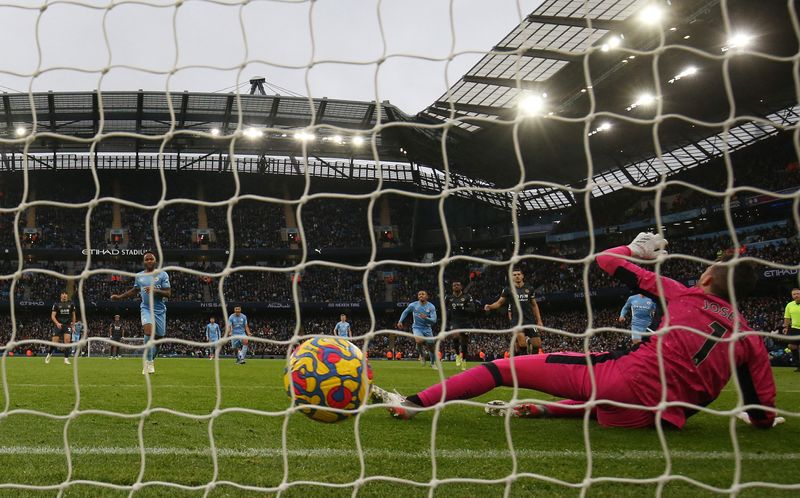 &copy; Reuters. Soccer Football - Premier League - Manchester City v Wolverhampton Wanderers - Etihad Stadium, Manchester, Britain - December 11, 2021 Manchester City's Raheem Sterling scores their first goal from the penalty spot Action Images via Reuters/Jason Cairnduf