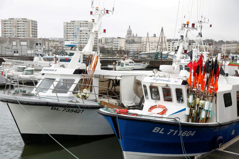 &copy; Reuters. FILE PHOTO: Fishing trawlers are docked at Boulogne-sur-Mer after Britain and the European Union brokered a last-minute post-Brexit trade deal, northern France, December 28, 2020. REUTERS/Charles Platiau