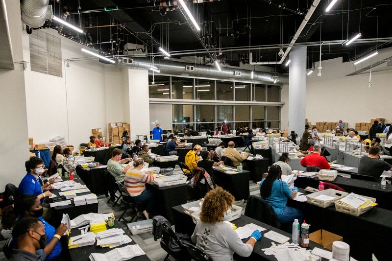 &copy; Reuters. FILE PHOTO: Employees of the Fulton County Board of Registration and Elections process ballots in Atlanta, Georgia, U.S., November 4, 2020. REUTERS/Brandon Bell/File Photo