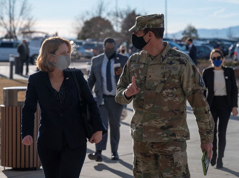 © Reuters. Deputy Secretary of Defense Kathleen H. Hicks speaks with Space Training and Readiness Command Deputy Commander Brig. Gen. Todd Moore during a recent trip to Schriever Space Force Base, Colorado, U.S. December 13, 2021.  DoD photo by U.S. Air Force Staff Sgt. Brittany A. Chase/Handout   