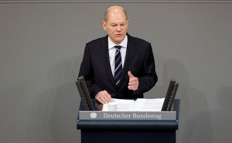 &copy; Reuters. German Chancellor Olaf Scholz speaks as he gives a government declaration during a plenum session of the German lower house of parliament Bundestag in Berlin, Germany, December 15, 2021. REUTERS/Michele Tantussi