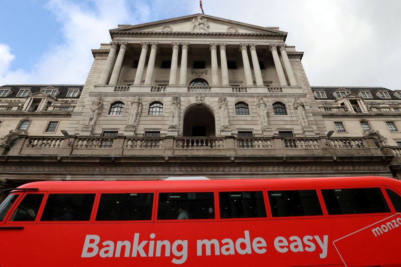 &copy; Reuters. FILE PHOTO: A bus passes in front of the Bank of England, in London, Britain October 31, 2021. REUTERS/Tom Nicholson/File Photo