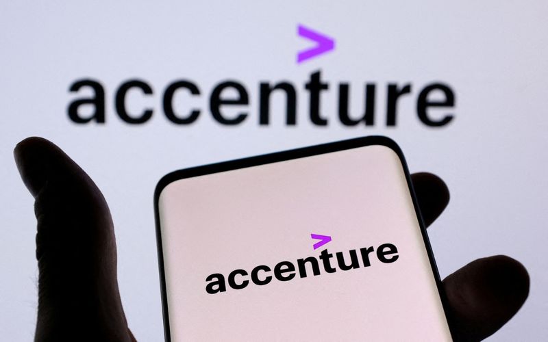 &copy; Reuters. FILE PHOTO: Accenture PLC logo is seen on a smartphone in front of displayed same logo in this illustration taken, December 1, 2021. REUTERS/Dado Ruvic/Illustration/File Photo