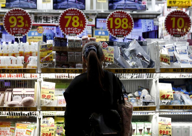 &copy; Reuters. FILE PHOTO: A woman looks at items outside an outlet store at a shopping district in Tokyo, Japan, February 25, 2016. REUTERS/Yuya Shino/File Photo