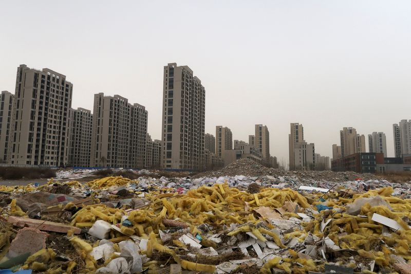 &copy; Reuters. Debris is seen in front of the apartment compound Taoyuan Xindu Kongquecheng developed by China Fortune Land Development, in Zhuozhou, Hebei province, China March 19, 2021. Picture taken March 19, 2021. REUTERS/Lusha Zhang