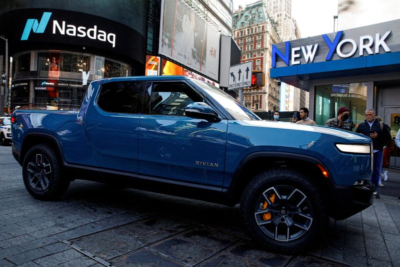 &copy; Reuters. FILE PHOTO: A Rivian R1T pickup, the Amazon-backed electric vehicle (EV) maker, is driven outside the Nasdaq Market site during the company’s IPO in Times Square in New York City, U.S., November 10, 2021.  REUTERS/Brendan McDermid/File Photo