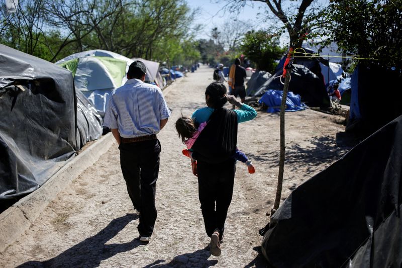 &copy; Reuters. FILE PHOTO: Migrants, asylum seekers sent back to Mexico from the U.S. under the "Remain in Mexico" program officially named Migrant Protection Protocols (MPP), are seen at provisional campsite near the Rio Bravo in Matamoros, Mexico February 27, 2020. RE