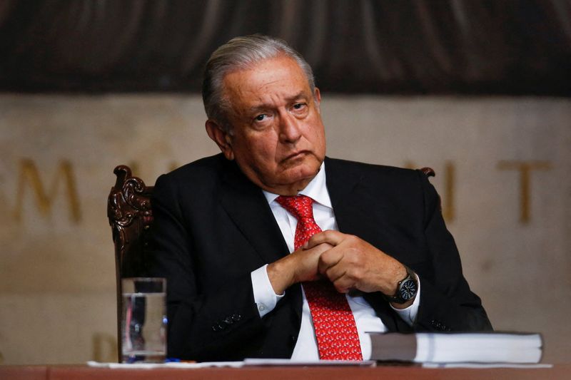 © Reuters. FILE PHOTO: Mexico's President Andres Manuel Lopez Obrador listens to the President of the Supreme Court of Justice (SCJN) Arturo Zaldivar delivering his third annual report, at the Court premises in Mexico City, Mexico December 15, 2021. REUTERS/Gustavo Graf/File Photo