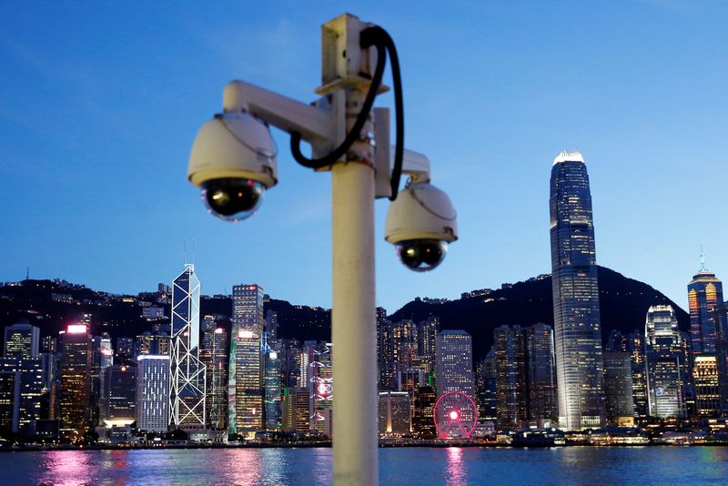 &copy; Reuters. A pair of surveillance cameras are seen along the Tsim Sha Tsui waterfront as skyline buildings stand across Victoria Harbor in Hong Kong, China July 28, 2020. REUTERS/Tyrone Siu