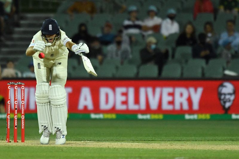 &copy; Reuters. Cricket - Ashes - Second Test - Australia v England - Adelaide Oval, Adelaide, Australia - December 19, 2021 England's Joe Root is hit by the ball REUTERS/Morgan Sette