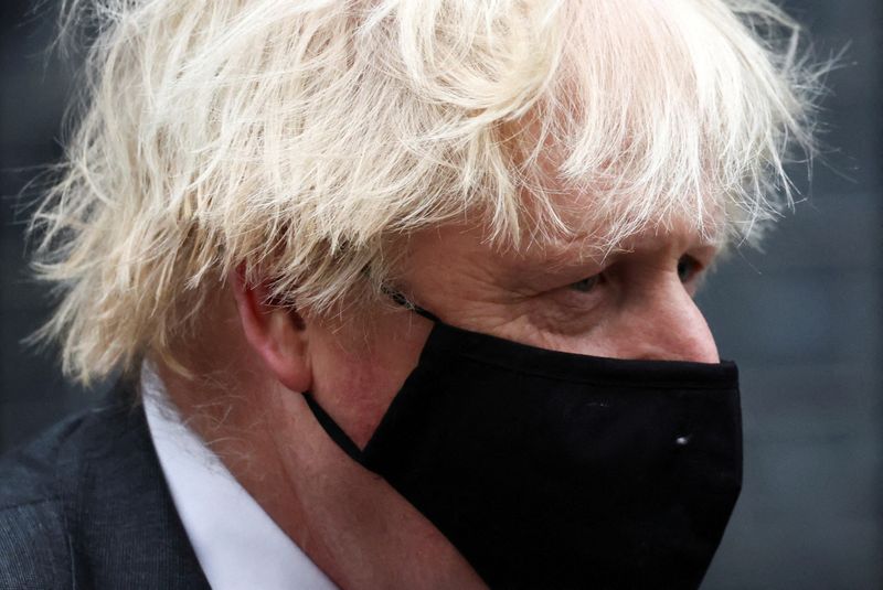 &copy; Reuters. FILE PHOTO: British Prime Minister Boris Johnson walks outside Downing Street in London, Britain, December 15, 2021. REUTERS/Henry Nicholls