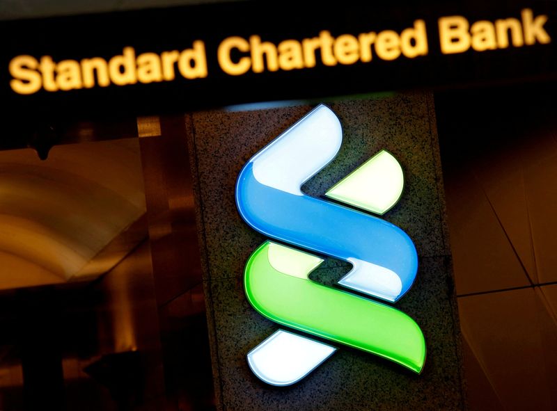 &copy; Reuters. A logo of Standard Chartered is displayed at its main branch in Hong Kong, China, Aug. 1, 2017. REUTERS/Bobby Yip/File Photo