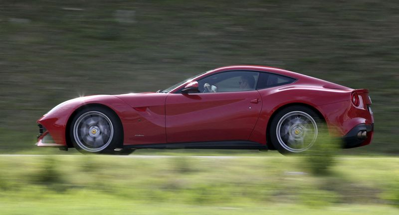 &copy; Reuters. FILE PHOTO: A man drives a Ferrari luxury car in Ferrari's hometown of Maranello, Italy, October 9, 2015. REUTERS/Stefano Rellandini/File Photo