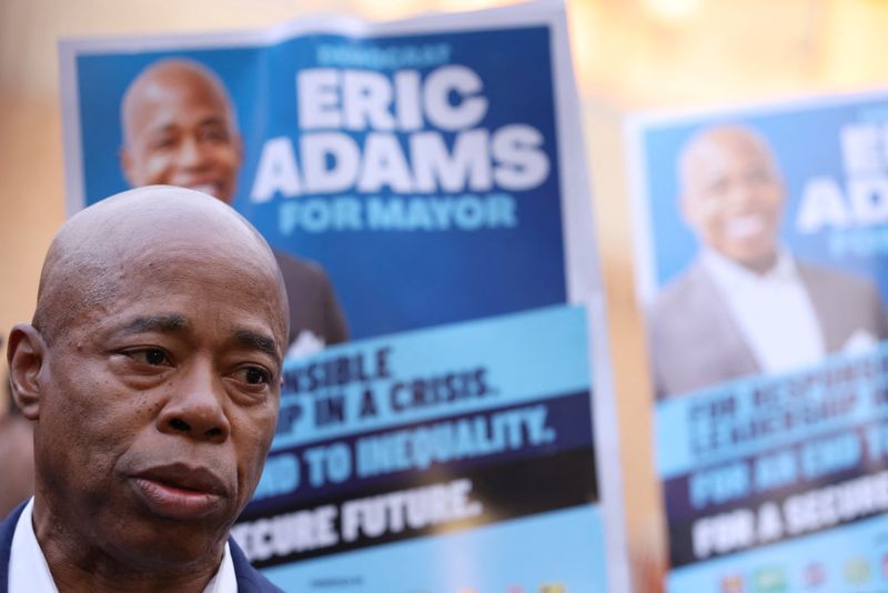 &copy; Reuters. FILE PHOTO: Democratic candidate for New York City Mayor Eric Adams looks on while speaking to media after voting in the New York City mayoral election at P.S. 81 in Brooklyn, New York, U.S., November 2, 2021. REUTERS/Andrew Kelly